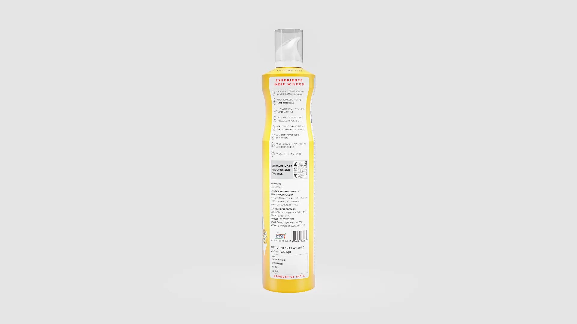 Bottle of oil spray with a yellow label on a white background